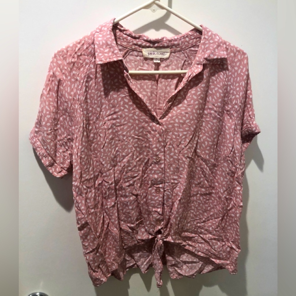 Pink and white print button up blouse.